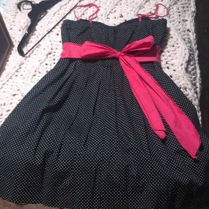 Black and White polkadot dress with pink sash